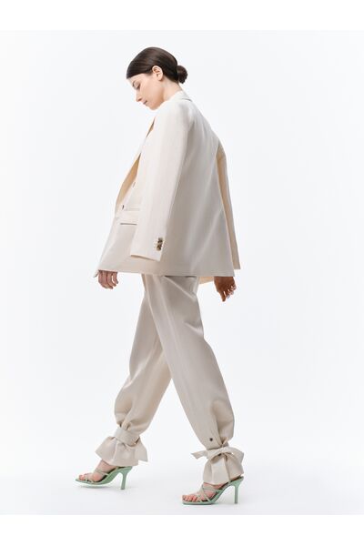 Широкие брюки с хлястиками от byME 