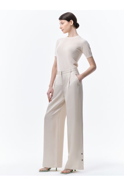 Широкие брюки с хлястиками от byME 